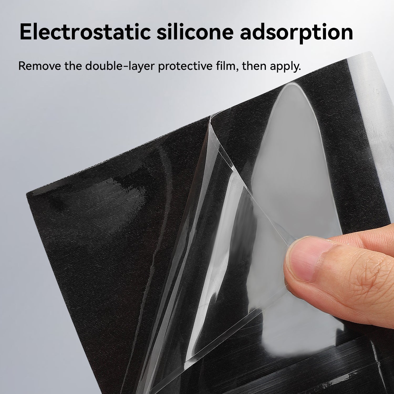 A close-up of a hand peeling a double-layer protective film from a black sheet, demonstrating the "Electrostatic silicone adsorption" technology. The text instructs to "Remove the double-layer protective film, then apply."